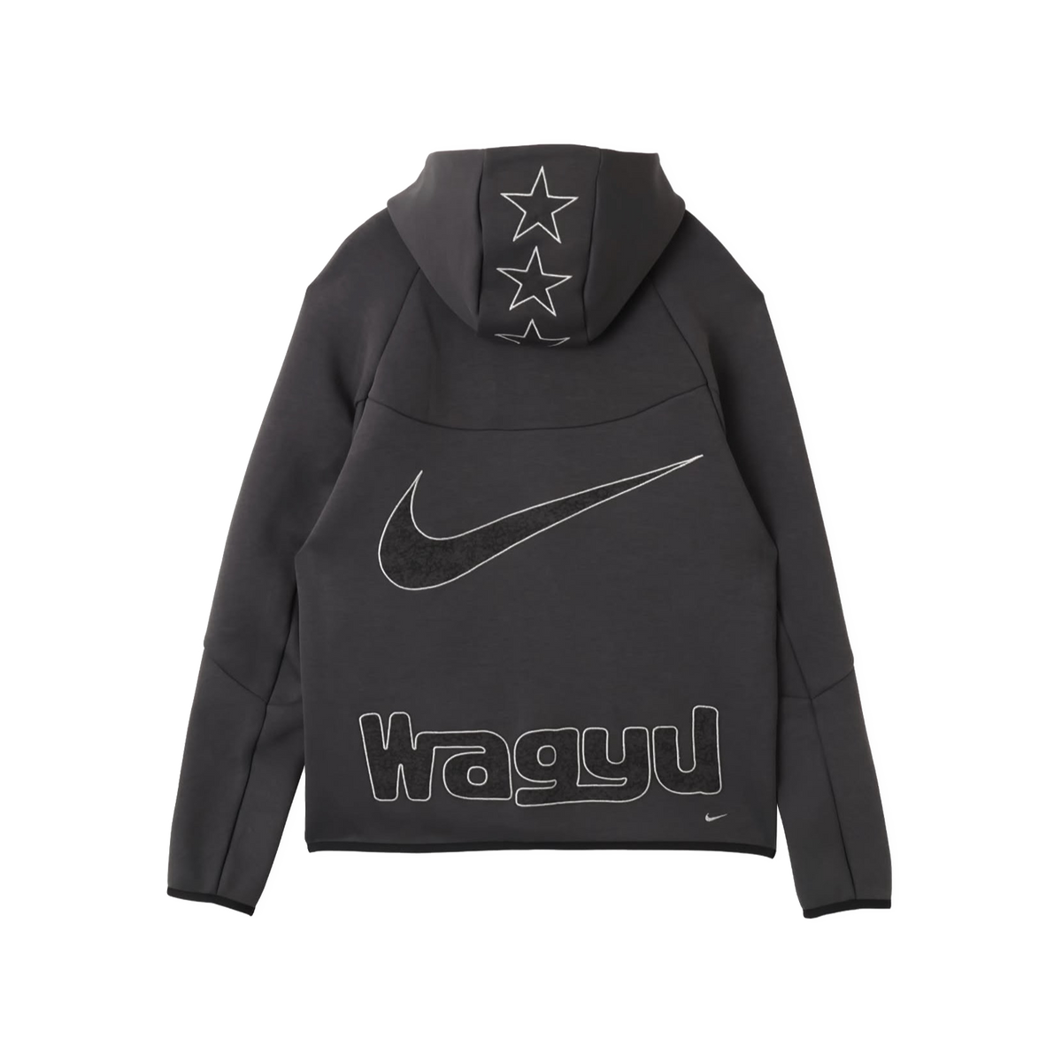 A dark gray Nike hoodie shown from the back, featuring a large white outlined swoosh, the word 'Wagyu' across the lower back, and three outlined stars on the hood.